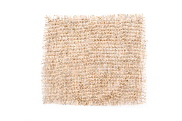 istock Square piece of beige canvas, sackcloth isolated on white 1369296158