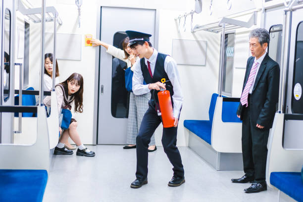 istock Conductor extinguishing a fire in a train car 1369296633