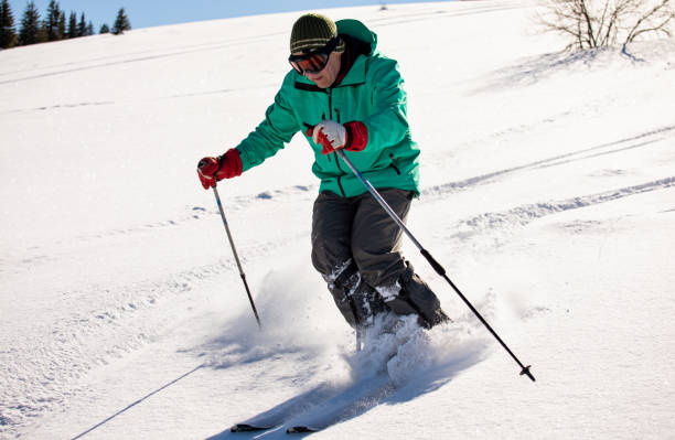 istock Senior skier having fun in an off-piste fresh snow 1369297907