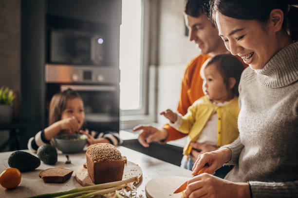 istock Family together in kitchen 1369299284