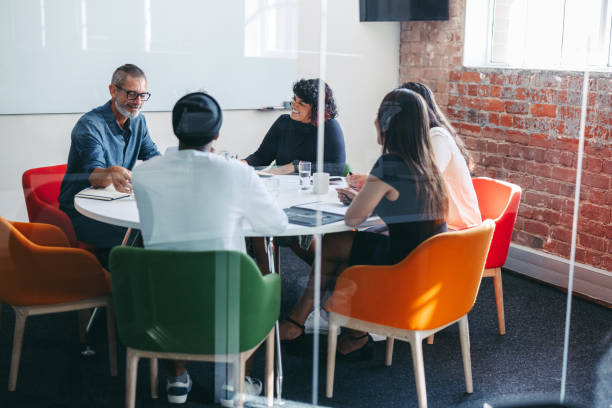 istock Successful businesspeople having a meeting in a modern office 1369299300