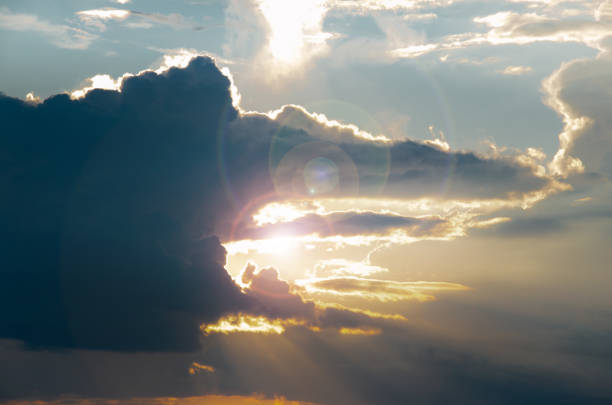 Beautiful evening cloudy sky. Pink warm clouds at the sunset. Colorful background