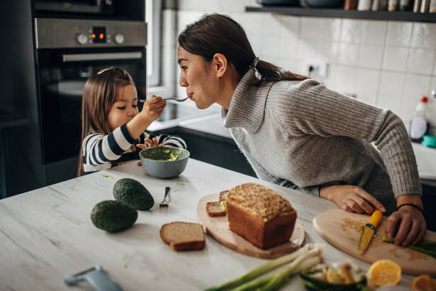 istock Mom and daughter in kitchen 1369300866