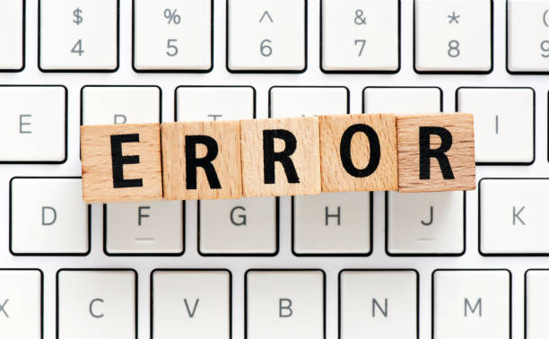 istock The word ERROR made of wooden letters arranged on a white computer keyboard. 1369300878
