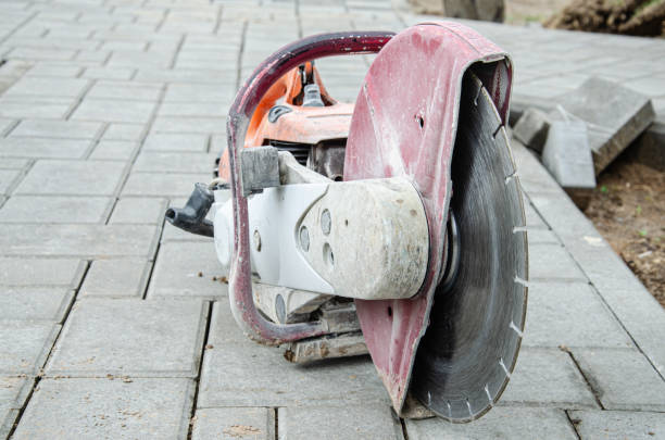 istock Concrete cutter machinery and cutting blade on a driveway 1369300885