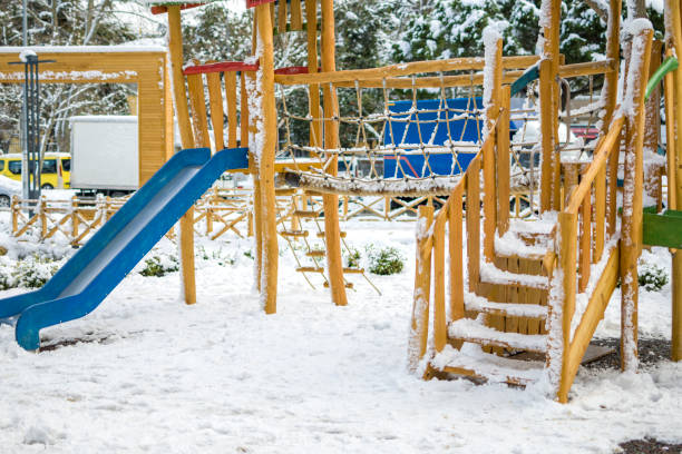istock Beautiful winter park, kinder garden with snow 1369300912