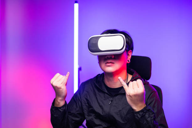 istock Young man interesting with virtual simulated world. Into the future digital cyber universe. Future technology vr concept. 1369301302