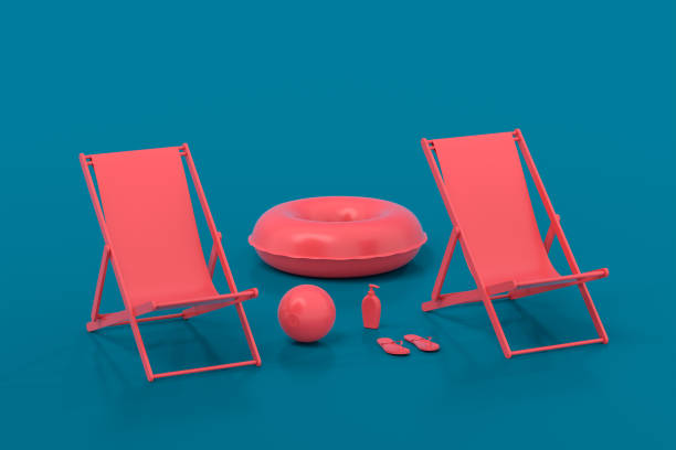 istock Beach chair with inflatable ring and beach ball on blue background. 1369301567