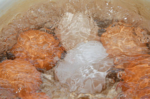 istock boiling eggs with hot water and aluminium 1369301755