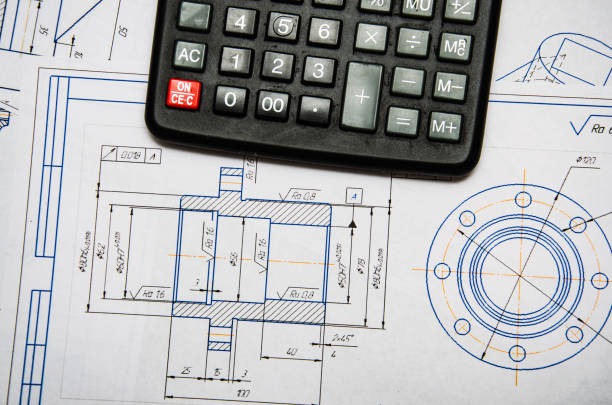 istock High angle view on the plan of electrical installation with calculator 1369301906