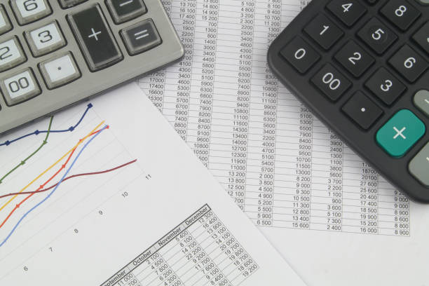 istock Business concept with two calculators and financial documents 1369303863