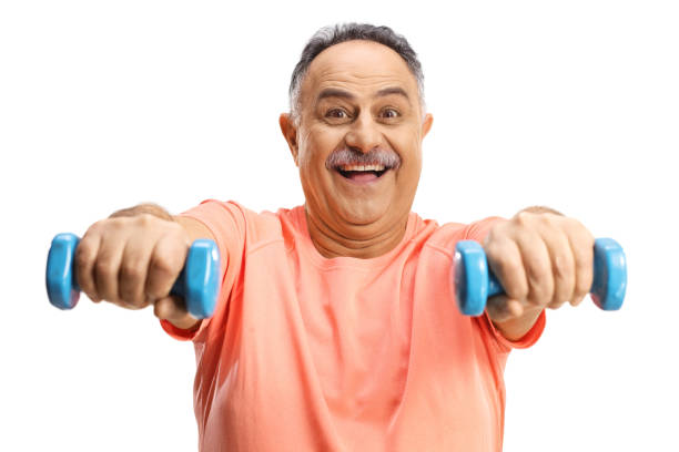 istock Happy mature man in exercising with dumbbells 1369305435