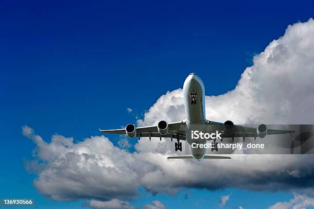 Xxl Jet Airplane Landing In Cloudy Sky Stock Photo - Download Image Now - Airplane, Blue, Freight Transportation