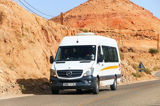 Al Haouz Province, Morocco - September 23, 2019: White touristic minibus Mercedes-Benz Sprinter (W906) at the Atlas Mountains.