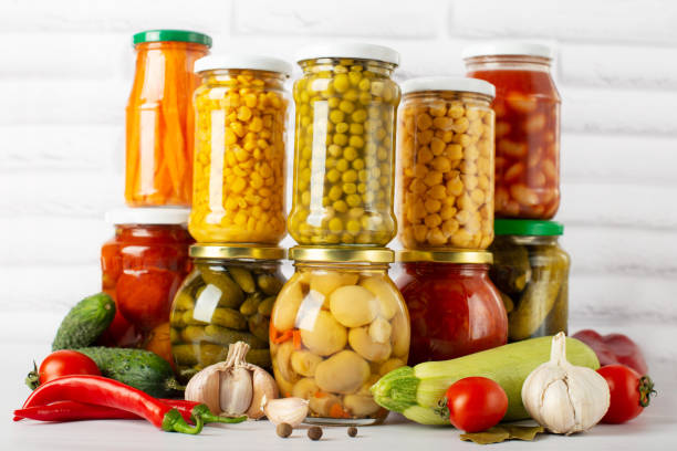 istock canned food on a white table with vegetables, different types of canned vegetables 1369307891