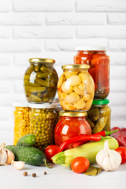 istock canned food on a white table with vegetables, different types of canned vegetables 1369307934