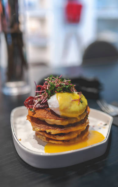 istock Breakfast with eggs and pancakes stock photo 1369308098