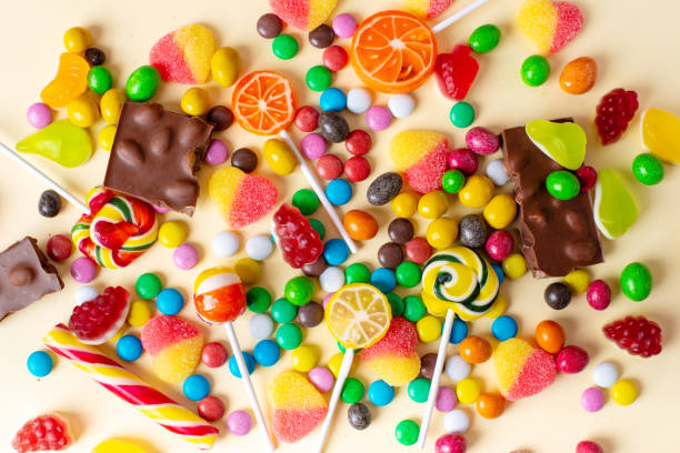 istock Mixed collection of colorful candy, on pink background. 1369308123