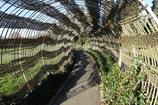 Tunnel made with wicker  Road circuit for children in a public park