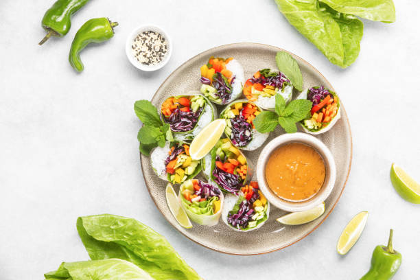 istock Vegan rainbow-colored spring rolls served with peanut sauce 1369309766