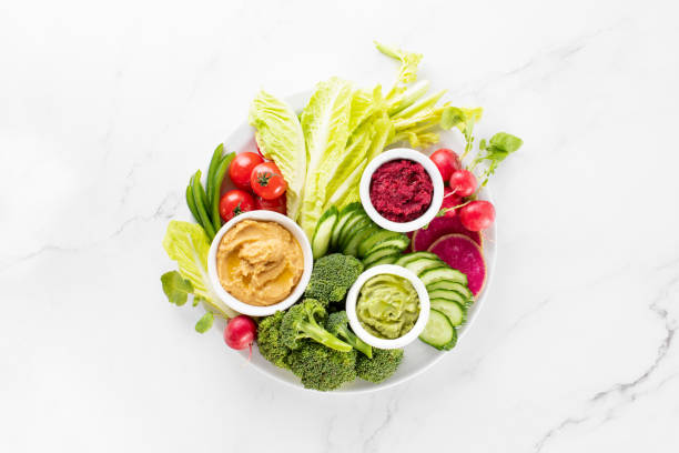 istock Fresh green veggie charcuterie platter with various dips 1369309800