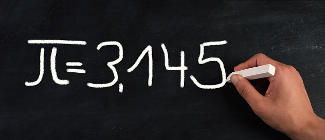 The mathematical constant pi 3,145 is standing on a chalkboard, defined in Euclidean geometry as the ratio of a circle's circumference to its diameter, physics and maths