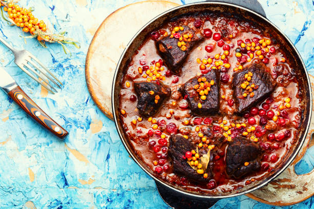 istock Meat stewed in autumn berries. 1369309883