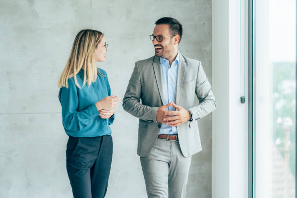 istock Two cheerful business people 1369312525