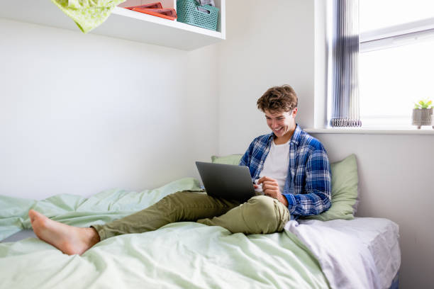 istock Watching a Movie in Bed 1369312760