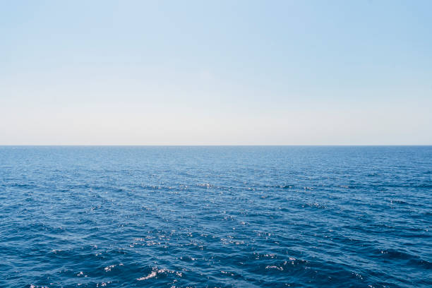 istock The front view in the morning sky is bright blue with clear white clouds. And the ocean deep indigo in daylight. Feeling calm, cool, relaxing. The idea for cold background and copy space on the top. 1369313107