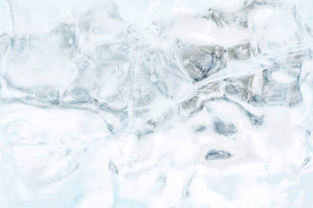 Ice texture crystal, blue tones background. Textured cold frosty surface of ice.