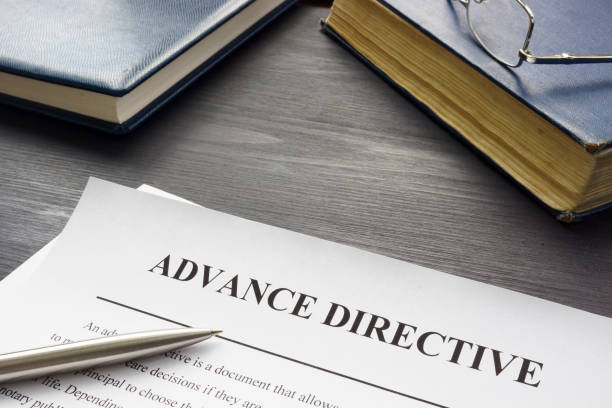 istock Medical Advance directive form and book with glasses. 1369314733