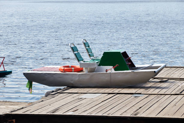 istock recreational catamaran on the summer lake shore 1369315191