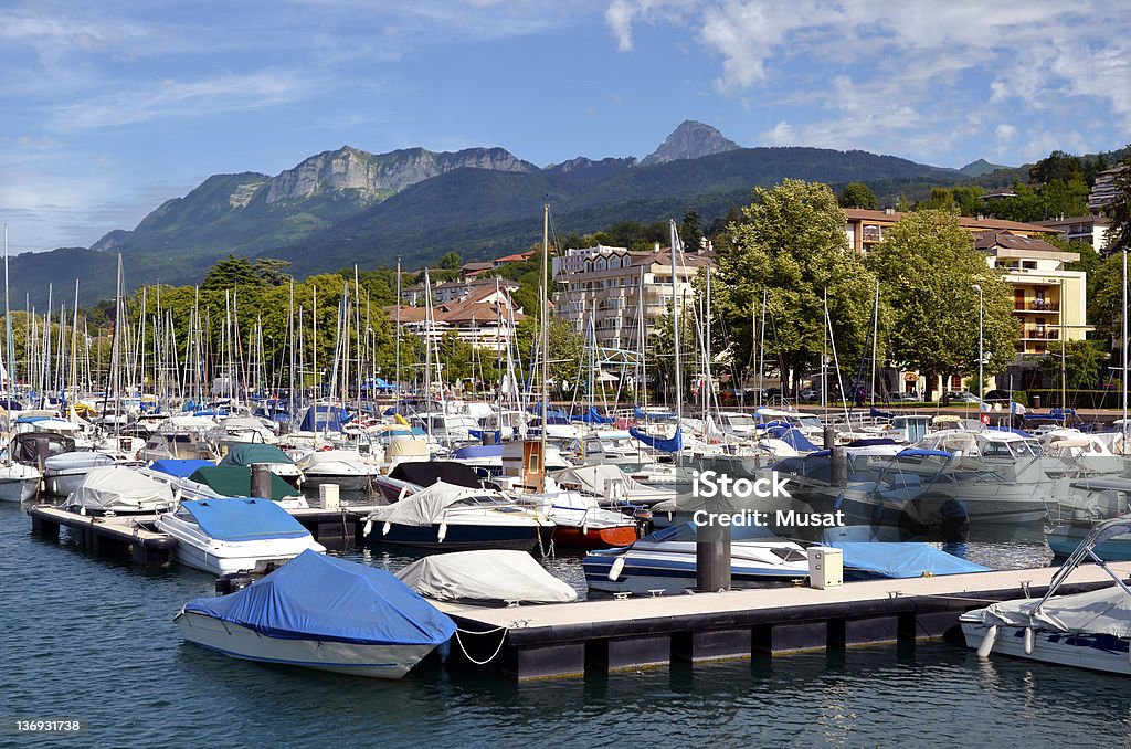 The port of Evian-les-bains in France Port of Evian-les-Bains on the banks of Léman lake to the east of France, commune in the Haute-Savoie department in the Rhône-Alpes region, mountains in the background Evian-les-Bains Stock Photo
