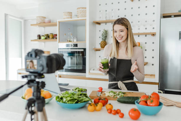 istock Young woman vlogging in the kitchen 1369317865