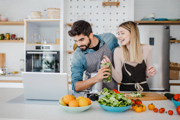 istock Young couple looking for recipes online 1369318012