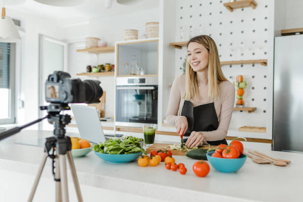 istock Young woman vlogging in the kitchen 1369318074