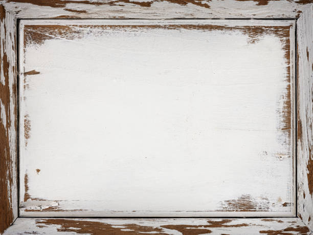 istock Old worn, weathered, white painted teak wood panel with a frame. 1369318124