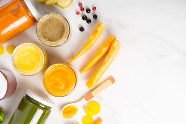 three jars of vegetables puree as baby food. Three jars of baby food on white background. set of various baby purees in a jar.