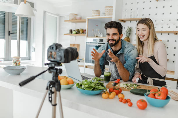 istock Young couple vlogging in the kitchen 1369318240
