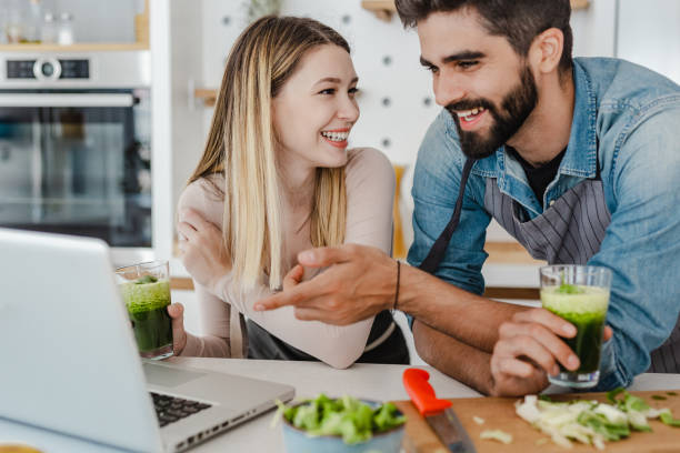 istock Young couple looking for recipes online 1369318378