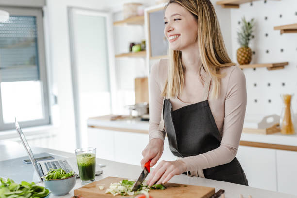 istock Young woman in the kitchen 1369318483