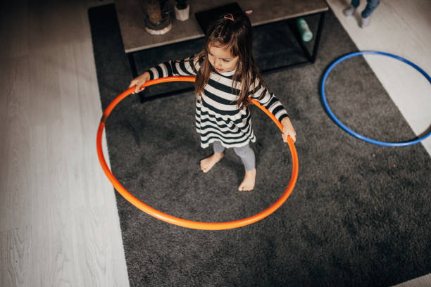Kids toy, Colorful plastic rings on foam mat, suitable for child play, learning activities, and developmental concepts, Top view