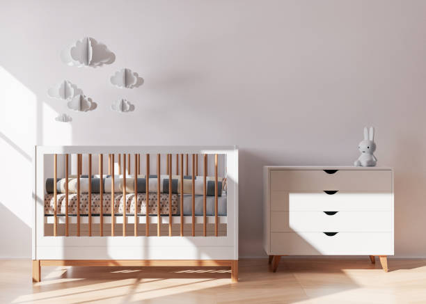 istock Empty white wall in modern child room. Mock up interior in contemporary style. Free space, copy space for your picture, text, or another design. Baby bed, console. Cozy room for kids. 3D rendering. 1369320144