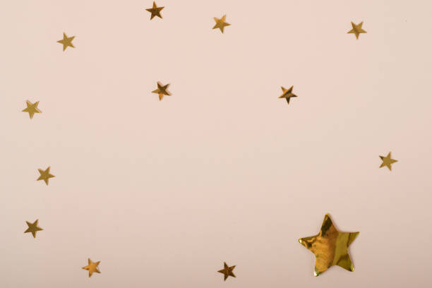 istock beige background with stars. Christmas. Wedding. Birthday. Flat lay 1369323016