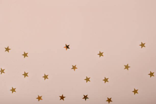 istock beige background with stars. Christmas. Wedding. Birthday. Flat lay 1369323070