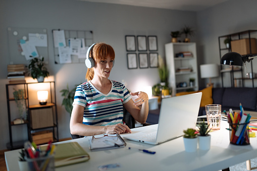 Young woman at home, working and studying from home