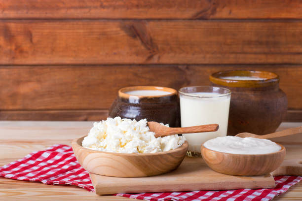 istock cottage cheese, milk and rustic sour cream on a wooden table 1369324772