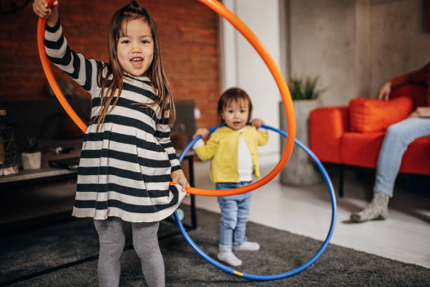 istock Little sisters playing at home 1369325092