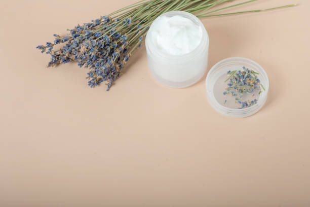 istock body cream with lavender on a beige background. 1369325226